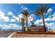 The Mountain Falls sign welcomes you into the community, framed by palm trees and blue skies at 5341 E La Campana Dr, Pahrump, NV 89061