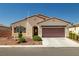 Charming single-story home with a well-manicured front yard and a two-car garage at 5341 E La Campana Dr, Pahrump, NV 89061
