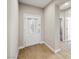 Bright foyer features wood-look flooring and an elegant front door with decorative glass at 5341 E La Campana Dr, Pahrump, NV 89061