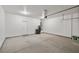 Spacious garage with high ceilings offers ample storage and parking, plus door to the interior at 5341 E La Campana Dr, Pahrump, NV 89061