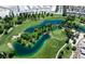 Aerial view of the lush golf course with mature trees and scenic water features at 5341 E La Campana Dr, Pahrump, NV 89061