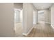 A well-lit hallway with multiple doorways leading to different rooms at 5341 E La Campana Dr, Pahrump, NV 89061
