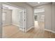 Inviting hallway with wood-look floors leading to various rooms in the home at 5341 E La Campana Dr, Pahrump, NV 89061