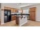 A kitchen with wood cabinets, an island, and stainless steel appliances at 5341 E La Campana Dr, Pahrump, NV 89061