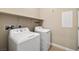 A laundry room featuring a white washer and dryer set at 5341 E La Campana Dr, Pahrump, NV 89061