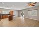 A spacious living room with wood flooring and an attached kitchen area at 5341 E La Campana Dr, Pahrump, NV 89061