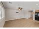 An open living room featuring wood flooring and a ceiling fan at 5341 E La Campana Dr, Pahrump, NV 89061