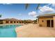 Beautiful pool area with plenty of lounge chairs and covered seating areas, perfect for relaxing at 5341 E La Campana Dr, Pahrump, NV 89061