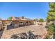 Large backyard with brick patio, covered area, solar panels and mature landscaping at 5453 Palisades Quad Ave, Las Vegas, NV 89122