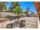 Well-maintained backyard with brick accents, gravel area, and lush landscaping at 5453 Palisades Quad Ave, Las Vegas, NV 89122