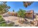 View of backyard with brick patio, covered area, and solar panels on the roof at 5453 Palisades Quad Ave, Las Vegas, NV 89122