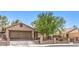 Attractive single-story home featuring desert landscaping, gated entry, and two-car garage at 5453 Palisades Quad Ave, Las Vegas, NV 89122