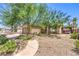 Charming home with desert landscaping and a walkway leading to the front door at 5453 Palisades Quad Ave, Las Vegas, NV 89122