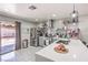 Modern kitchen featuring stainless steel appliances, subway tile backsplash, and a large quartz countertop island at 5453 Palisades Quad Ave, Las Vegas, NV 89122