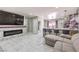 Stylish living room with fireplace and a breakfast bar featuring seating and modern decor at 5453 Palisades Quad Ave, Las Vegas, NV 89122