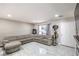 Bright and spacious living room with tile flooring, neutral colors, and sliding glass door at 5453 Palisades Quad Ave, Las Vegas, NV 89122