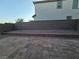 Backyard with brick retaining wall and paver patio, perfect for outdoor dining and entertainment at 5817 Bonita Rose St, Las Vegas, NV 89113