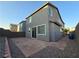 Gray two-story house featuring a backyard with stone pavers at 5817 Bonita Rose St, Las Vegas, NV 89113