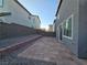 A lovely backyard with a brick patio and rock landscaping at 5817 Bonita Rose St, Las Vegas, NV 89113