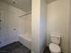 Standard bathroom includes a tub/shower combination and toilet at 5817 Bonita Rose St, Las Vegas, NV 89113