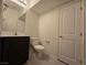 Clean and simple bathroom featuring a modern vanity, toilet, and essential fixtures at 5817 Bonita Rose St, Las Vegas, NV 89113