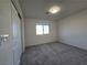 This bedroom features a soft carpet, window view, and plenty of space at 5817 Bonita Rose St, Las Vegas, NV 89113