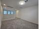 Spacious bonus room upstairs with plush carpet and neutral walls at 5817 Bonita Rose St, Las Vegas, NV 89113