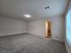 Bonus room featuring neutral paint, plush carpet, and ensuite bathroom at 5817 Bonita Rose St, Las Vegas, NV 89113