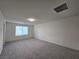 Carpeted bonus room with bright light and neutral tones at 5817 Bonita Rose St, Las Vegas, NV 89113