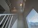 Bright open staircase with white railing and natural light at 5817 Bonita Rose St, Las Vegas, NV 89113