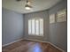 Bedroom with wood laminate flooring, shuttered windows, neutral paint, and ceiling fan at 601 Summer Mesa Dr, Las Vegas, NV 89144