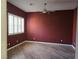 Red bedroom featuring modern ceiling fan and plantation shutters at 601 Summer Mesa Dr, Las Vegas, NV 89144