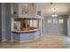 Spacious living area with recessed lights, kitchen pass-through, and tile flooring adjacent to dining area at 601 Summer Mesa Dr, Las Vegas, NV 89144