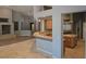 Open-concept living area that highlights modern lighting and a pass through to the spacious kitchen at 601 Summer Mesa Dr, Las Vegas, NV 89144