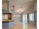 Bright living room featuring an open floor plan, high ceilings, and sliding glass doors to the backyard at 601 Summer Mesa Dr, Las Vegas, NV 89144