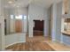 Bright, open living space with tile and hardwood flooring and a view into adjacent spaces at 601 Summer Mesa Dr, Las Vegas, NV 89144