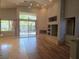 Inviting living room with fireplace, recessed lights, hardwood and tile floors and lots of natural light at 601 Summer Mesa Dr, Las Vegas, NV 89144
