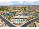An aerial photograph depicts a community center with pool, tennis courts, and verdant landscaping at 6114 Saddle Horse Ave, Las Vegas, NV 89122