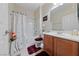 Well-maintained bathroom with tub and shower combination and wood vanity at 6114 Saddle Horse Ave, Las Vegas, NV 89122
