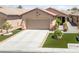 Charming single-story home featuring desert landscaping, a two-car garage, and a welcoming front entryway at 6114 Saddle Horse Ave, Las Vegas, NV 89122