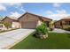 Charming single-story home with a two-car garage, well-maintained yard and desert landscaping at 6114 Saddle Horse Ave, Las Vegas, NV 89122