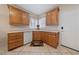 Kitchen area featuring wood cabinets, a sink with a window view, and modern appliances at 6114 Saddle Horse Ave, Las Vegas, NV 89122