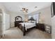 Serene main bedroom with plush carpeting, dark wood furniture, and soft natural lighting at 6114 Saddle Horse Ave, Las Vegas, NV 89122