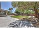 Spacious backyard boasts lush lawn, mature trees, a privacy wall, and a cozy fire pit area at 6821 Sleepy Pine St, Las Vegas, NV 89130