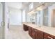 Bright bathroom with soaking tub, large mirror, and vanity with lots of counter space at 6821 Sleepy Pine St, Las Vegas, NV 89130