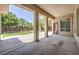 Large covered patio area offers a great view of the landscaped backyard and mature trees at 6821 Sleepy Pine St, Las Vegas, NV 89130