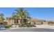 Single-story home featuring a three-car garage, desert landscaping, and palm trees at 6821 Sleepy Pine St, Las Vegas, NV 89130