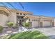 Inviting single-story home with a manicured lawn, desert landscaping, and a spacious three-car garage at 6821 Sleepy Pine St, Las Vegas, NV 89130