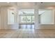 Open living room area with hardwood flooring and large windows offering natural light at 6821 Sleepy Pine St, Las Vegas, NV 89130