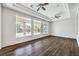 Living room featuring hardwood flooring, ceiling fans and natural light at 6821 Sleepy Pine St, Las Vegas, NV 89130
